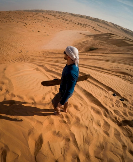 Sandboarding in the Oman desert