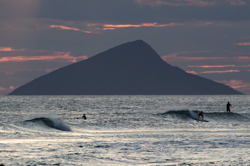 Surfers in Maresias beach - waves